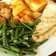 Recept: Roti met kip massala, aardappels en kouseband 