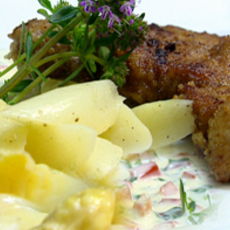 Recept: Gepaneerd kalfslapje met asperges en kruidenmousse